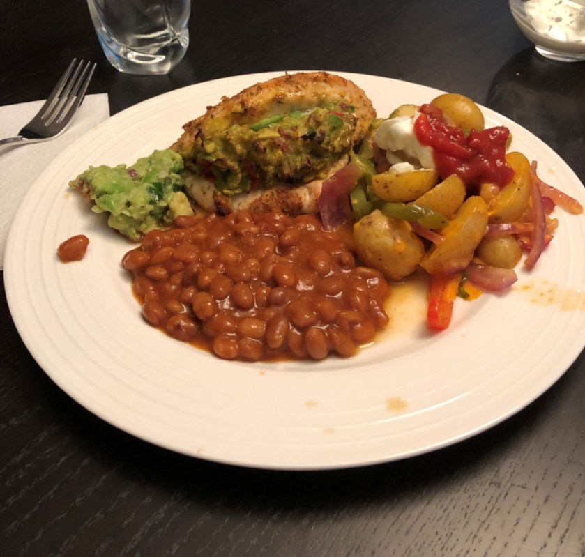 Guacamole stuffed chicken breast is extra delicious served with your favourite sides